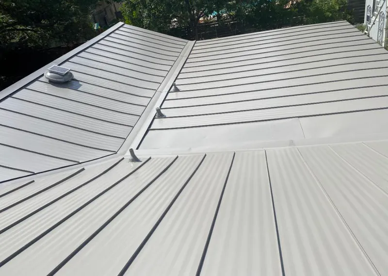 Solar attic fan installed on a metal roof for Roof Ventilation in Oldsmar